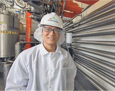 Worker dressed in gear in a plant