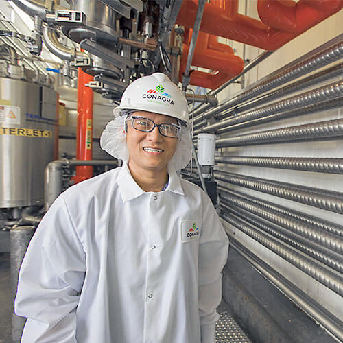Worker dressed in gear in a plant
