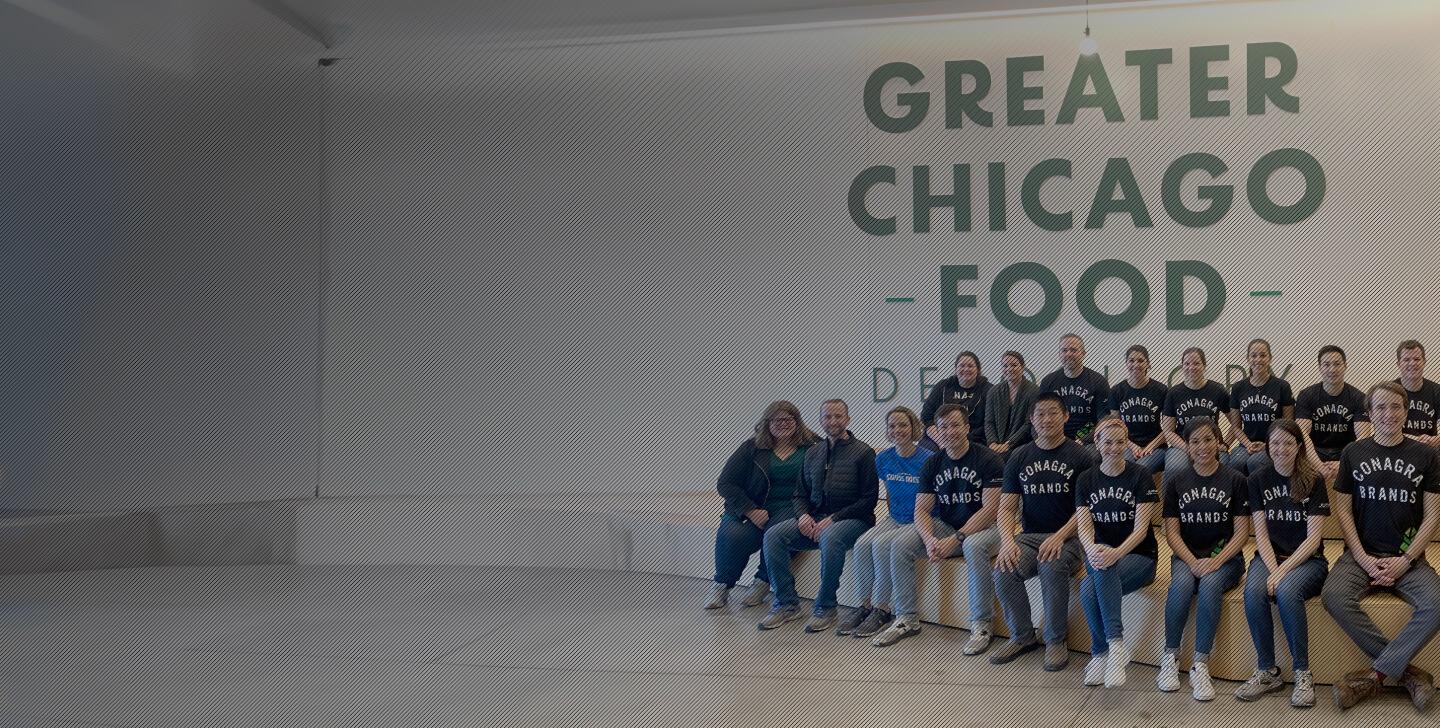 Conagra team posing with a Greater Chicago Food sign